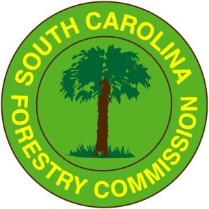Logo of the South Carolina Forestry Commission featuring a tree in the center with "South Carolina Forestry Commission" written in yellow surrounding the green and brown tree design.